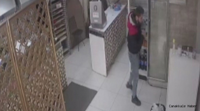 Hırsız ile işyeri sahibi arasında yaşanan arbede anları kameraya yansıdı