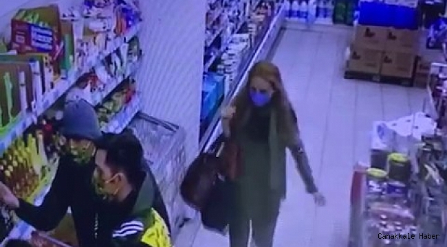 Markette kadın şahsın kaşla göz arasında telefon çaldığı anlar kamerada