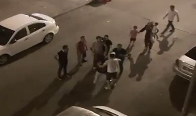 Eşine şiddet uyguladığı için darp edilmek istenen adam, yine eşinin arkasına saklandı